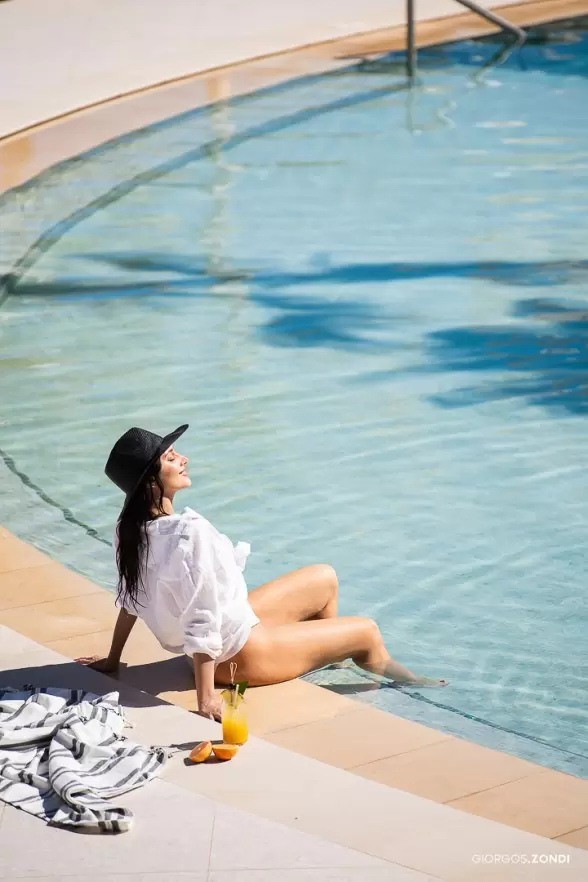 Lifestyle photo of the Nautilux Hotel poolside, featuring a luxurious and serene atmosphere.